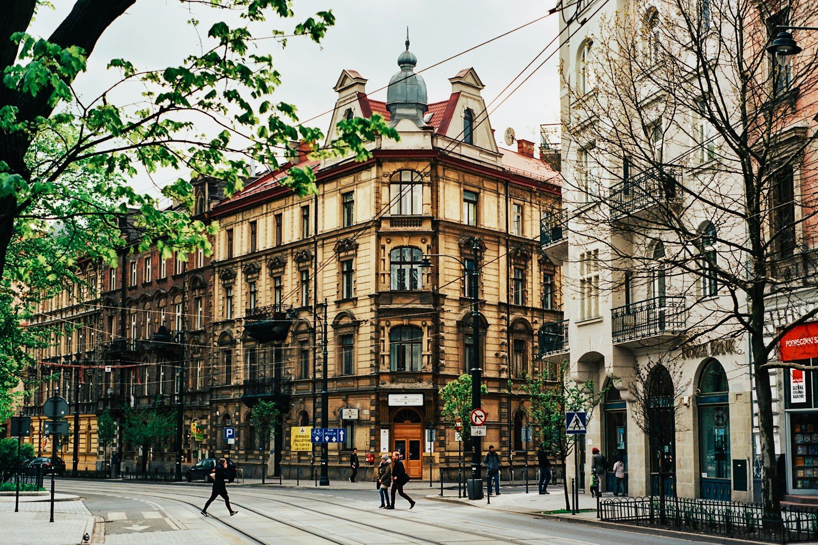 Jewish Krakow people walking near beige building