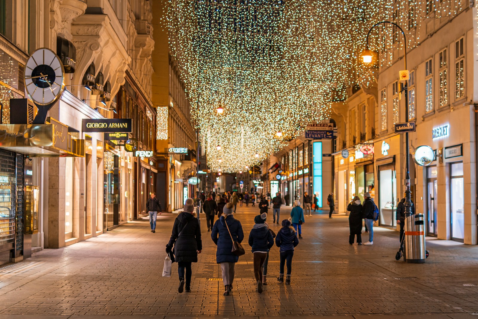 Vienna people walking on street during night time