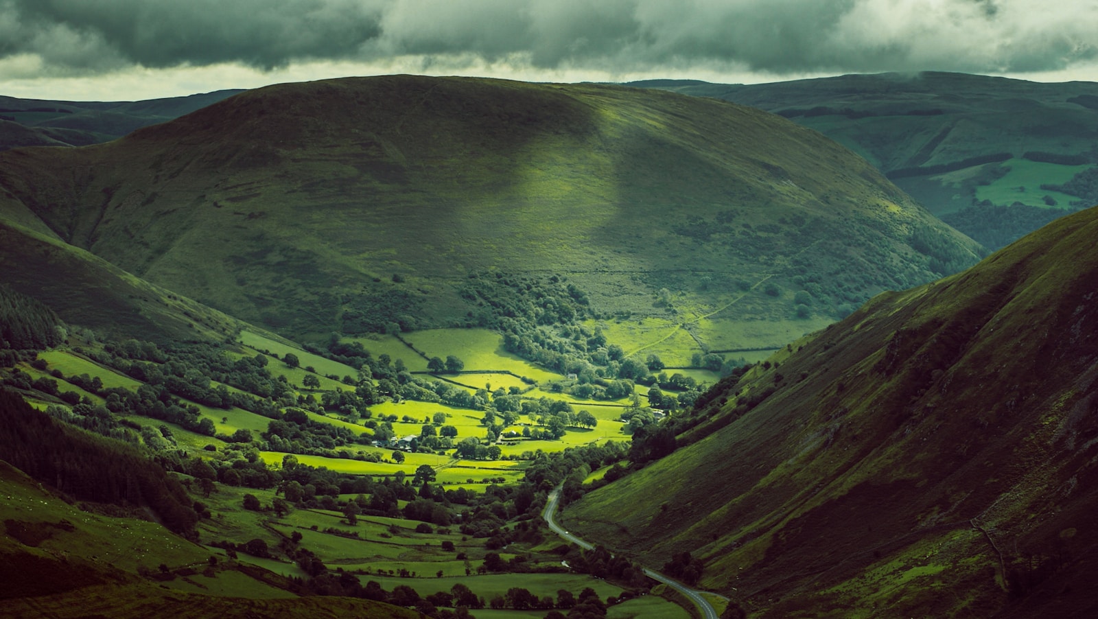 Wales green mountains under white clouds during daytime