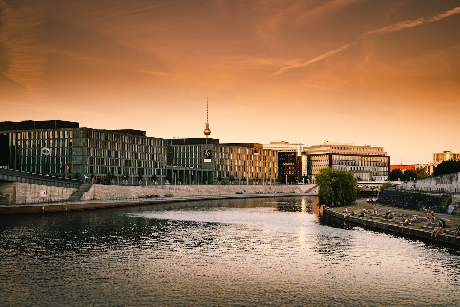 Berlin body of water between buildings during sunset