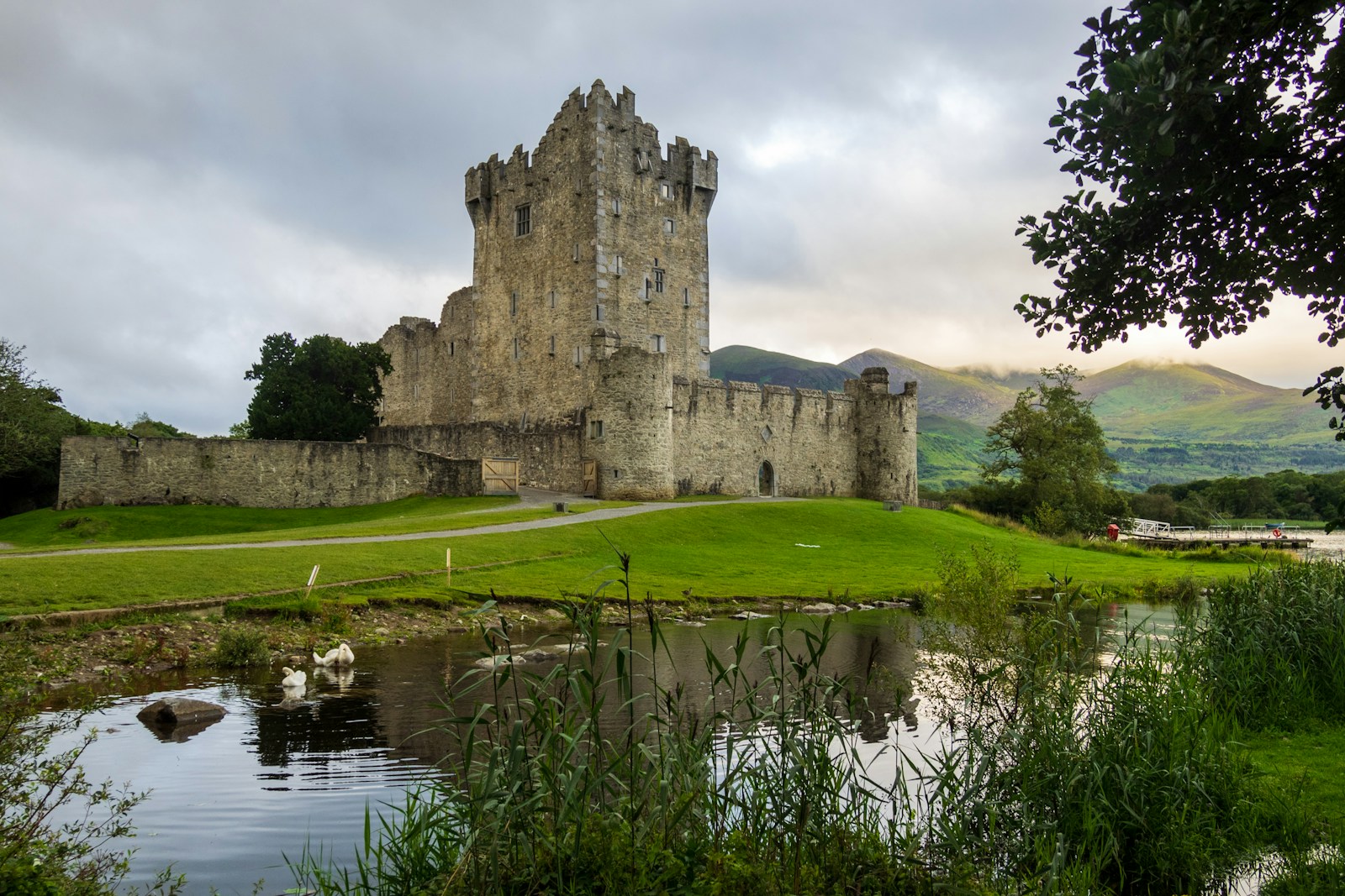 Killarney castle near pond during day