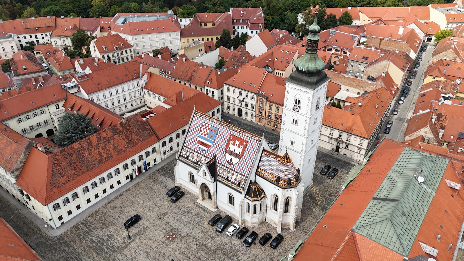 An aerial view of a city with red roofs
